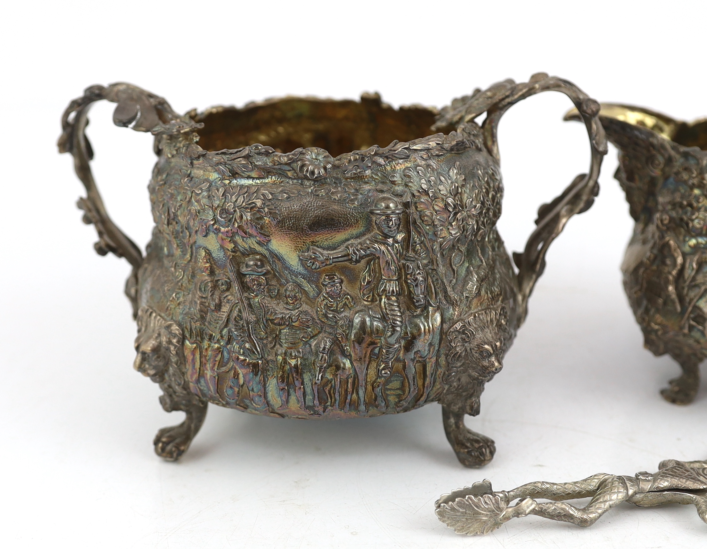 A George IV embossed silver sugar bowl and cream jug by Edward Farrell